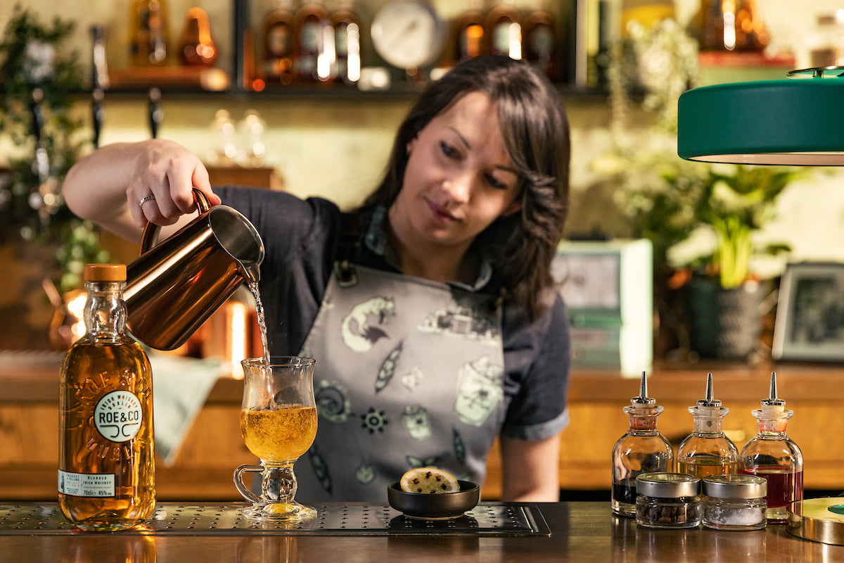 Roe & Co. master bartender making a cocktail with Roe & Co. 106 Irish Whiskey in the Roe & Co. Distillery Cocktail Bar in Dublin 8, James's Street.